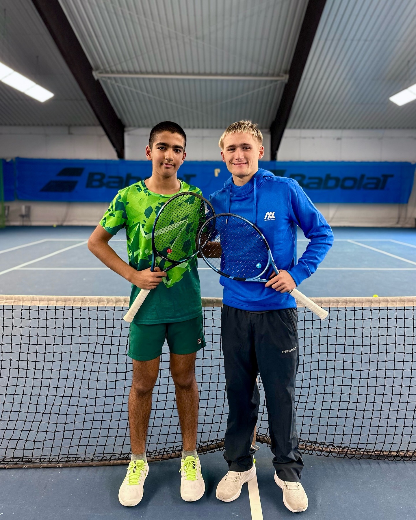 Sunit Lumb and coach Jasper Camehn standing together on a tennis court at the nensel academy 2026